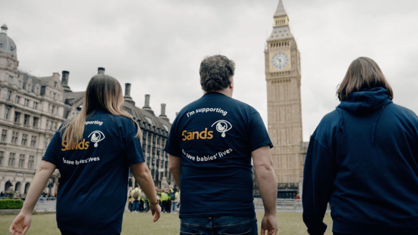 3 Sands Supporters walking towards Big Ben. 2 of the supporters are wearing Sands Tshirts.
