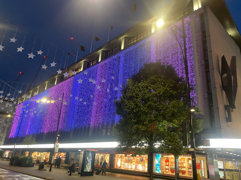 John Lewis Oxford Street store lit up in pink and blue lights for Baby Loss Awareness Week.