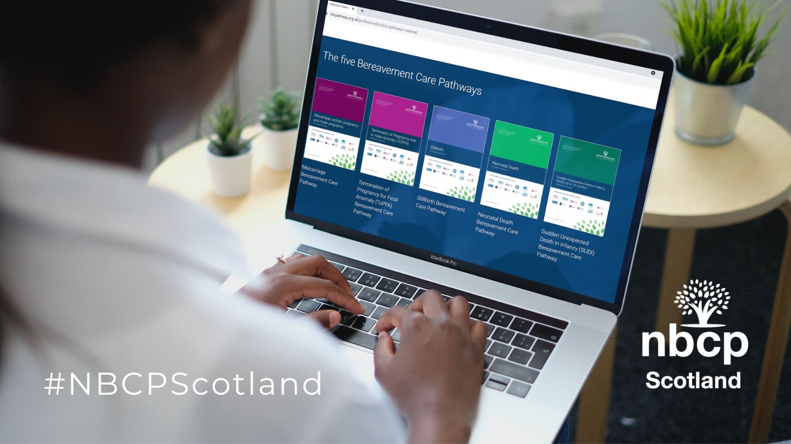 A woman with the Scottish National Bereavement Care Pathways on her laptop Screen.