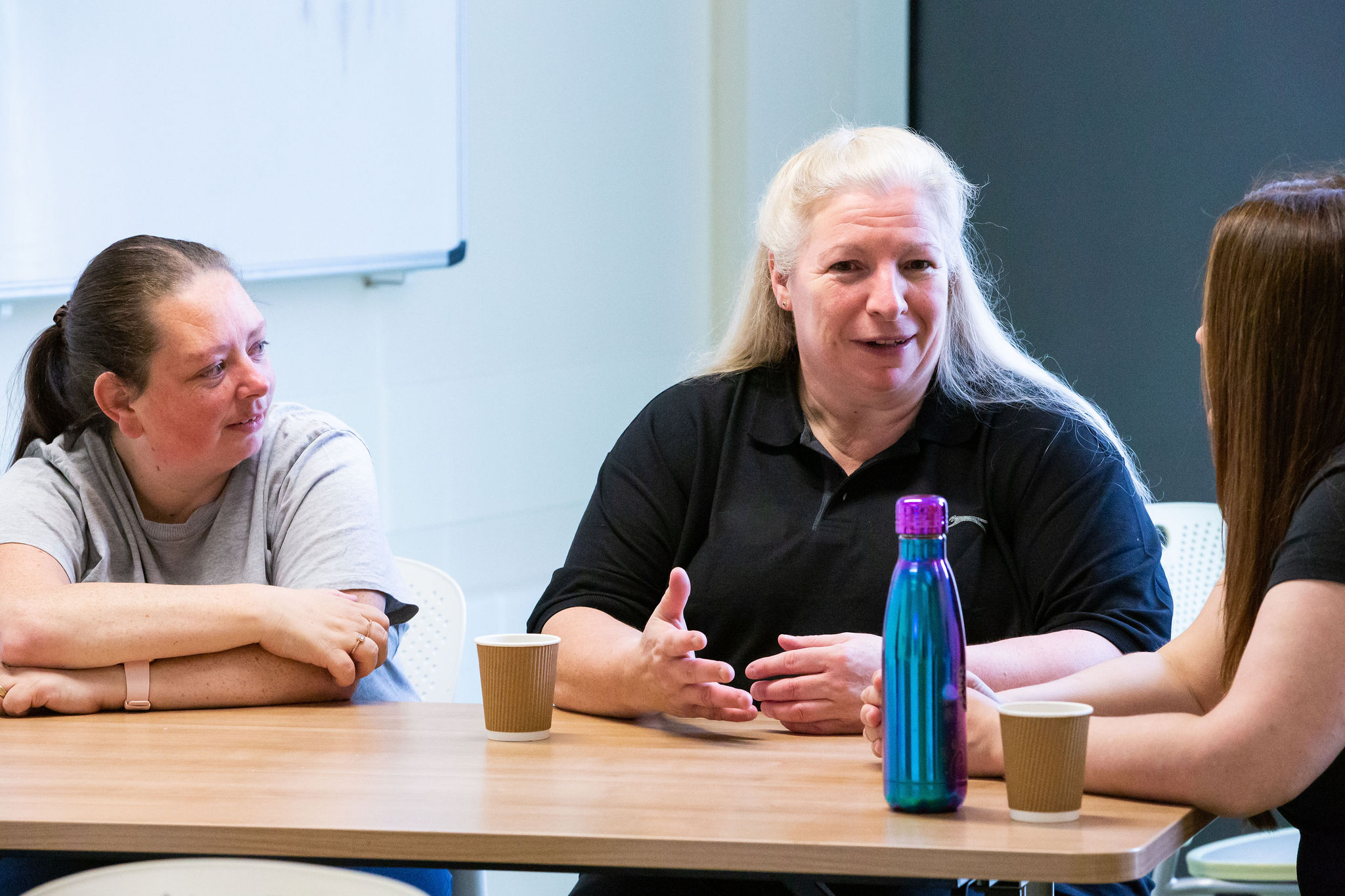 Healthcare professionals talking during a training session.
