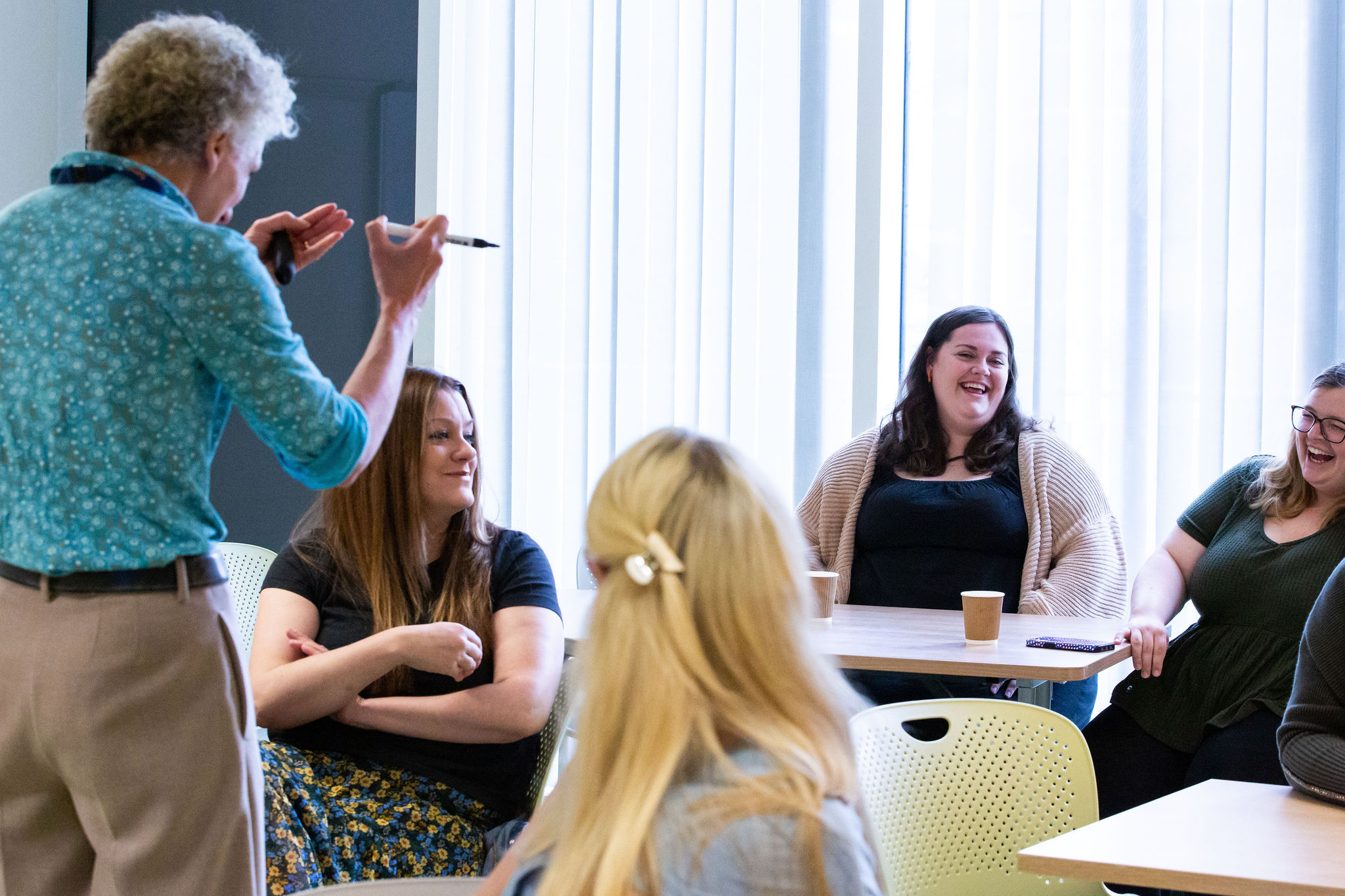 Sands trainer presenting to a group of healthcare professionals during a training sessions.